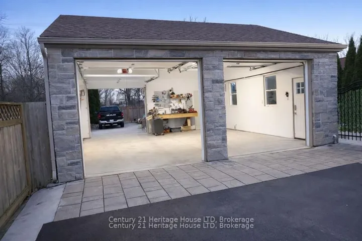 heated with tandem bay and concrete back driveway