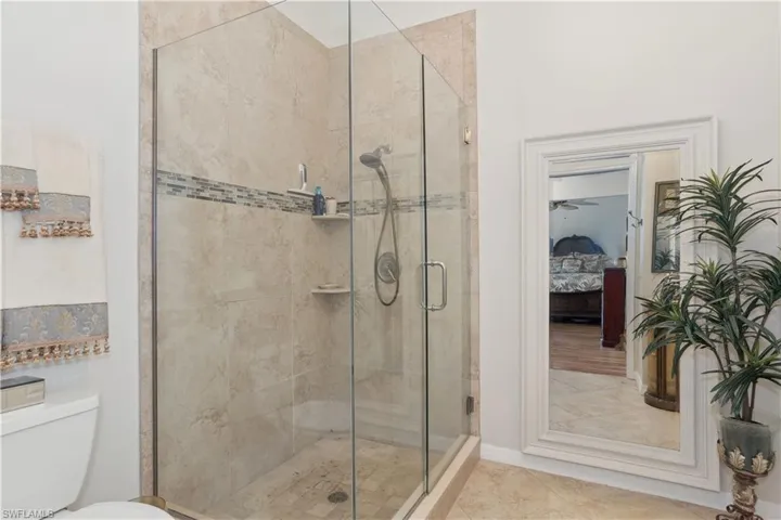 Bathroom with toilet and walk in shower