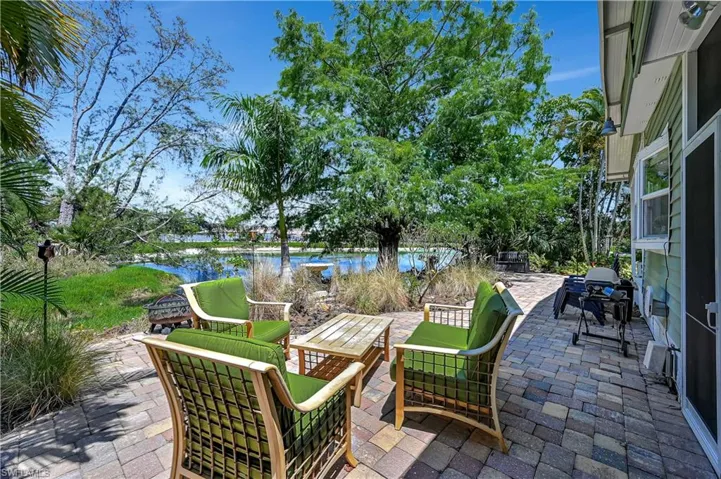 View of terrace with a water view