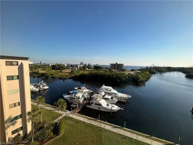 Dock area featuring a water view