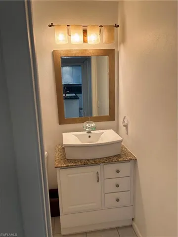 Bathroom with vanity and tile patterned floors