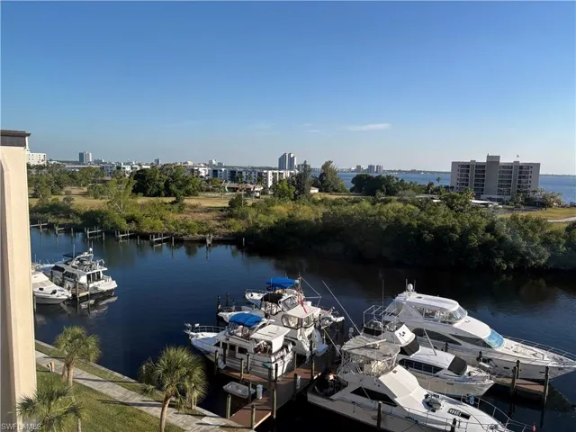 Dock area featuring a water view