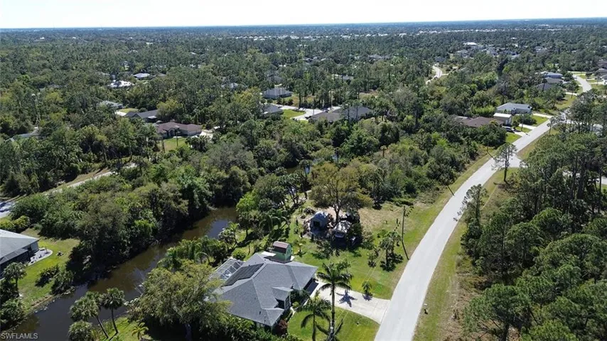 Aerial view with a residential view and a wooded view