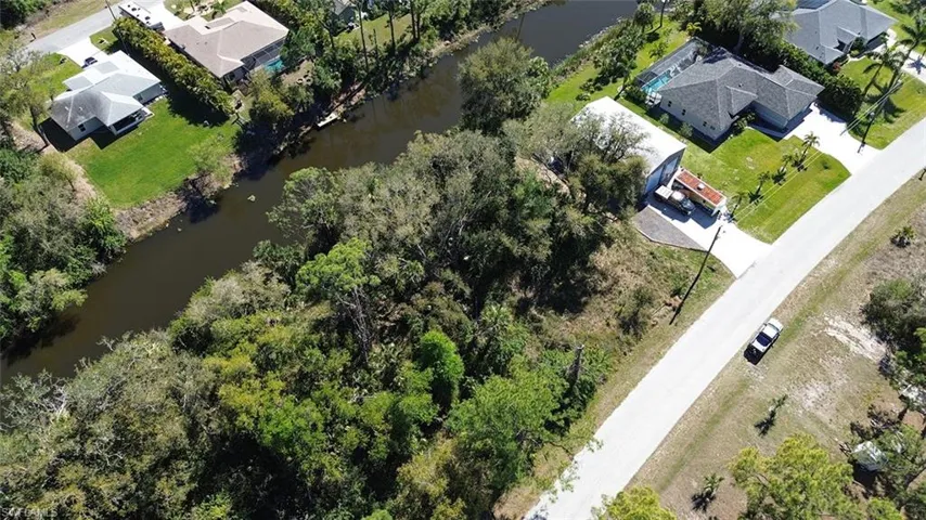 Drone / aerial view featuring a water view and a residential view