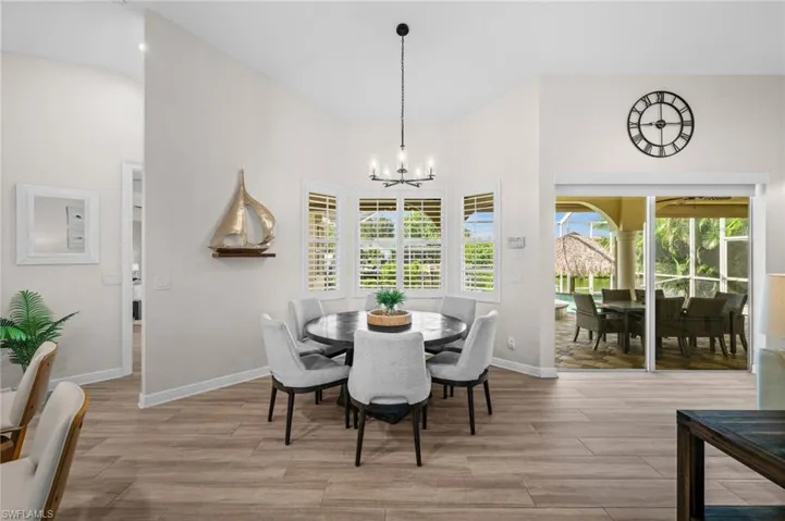 Dining area overlooks the pool and lanai