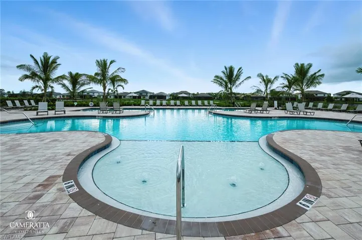 Community pool featuring a patio area