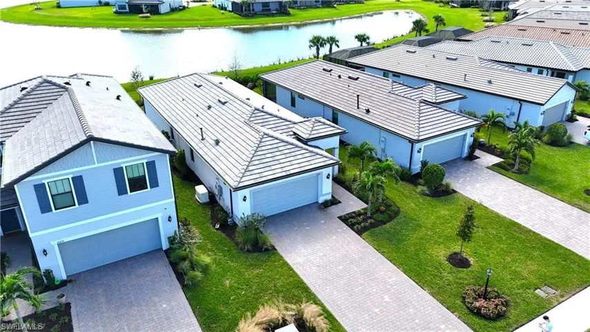 Aerial view of residential area featuring a large body of water