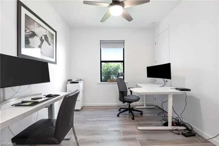 Office space featuring wood finish floors and ceiling fan