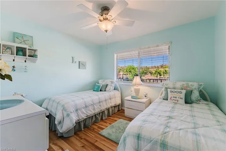 Bedroom featuring light wood finished floors and a ceiling fan