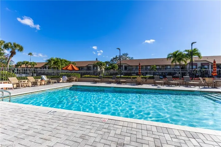 Community pool with a patio area