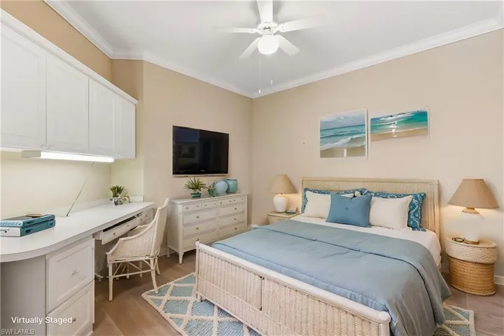Virtually staged as a guest bedroom with tile flooring and a ceiling fan.