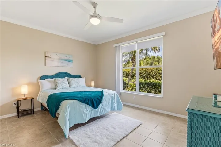 Ceramic flooring, ceiling fan/light fixture, vertical blinds with black-out shades.