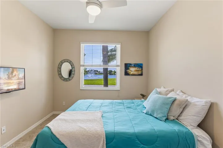 Bed and television being left for convenience of buyer.