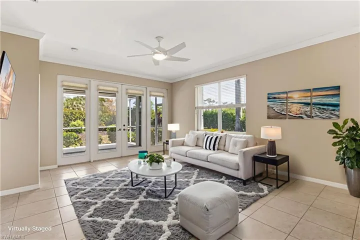 Virtually Staged. Living area featuring neutral wall tones and tile flooring