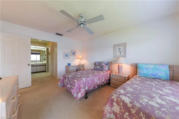 Carpeted Master bedroom featuring ceiling fan