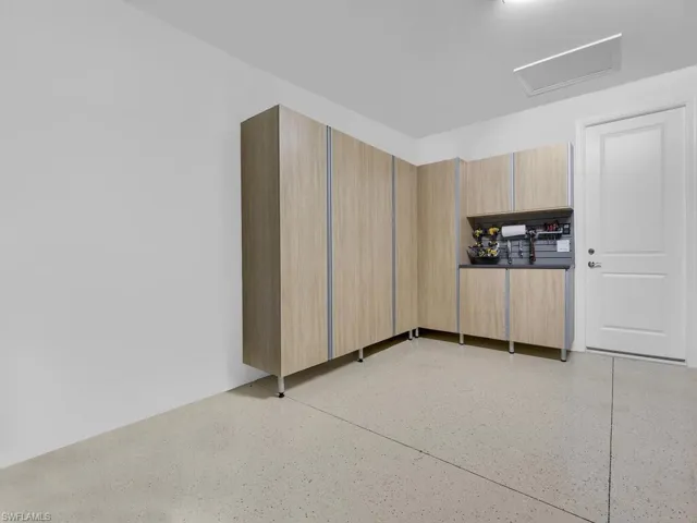 2 Car Garage with Custom Cabinetry for Storage