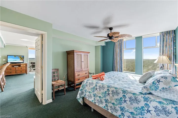 Bedroom featuring dark carpet and ceiling fan - VIRTUALLY ENHANCED