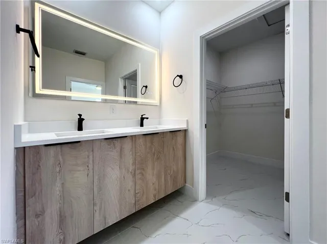 Bathroom with tile flooring and vanity