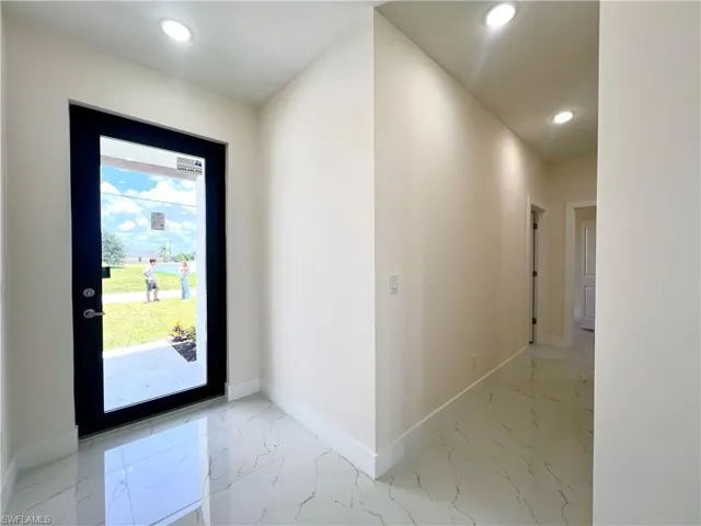 Foyer with tile floors