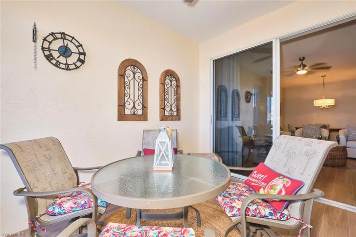 Dining room with wood finished floors and a ceiling fan