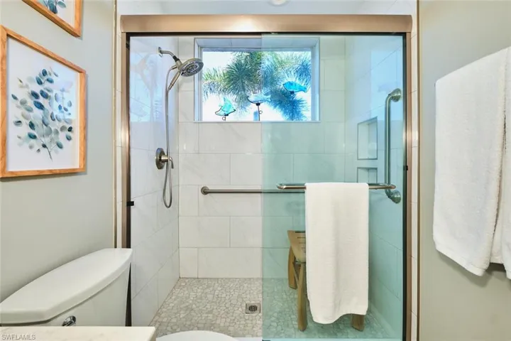 Full bath with a shower stall