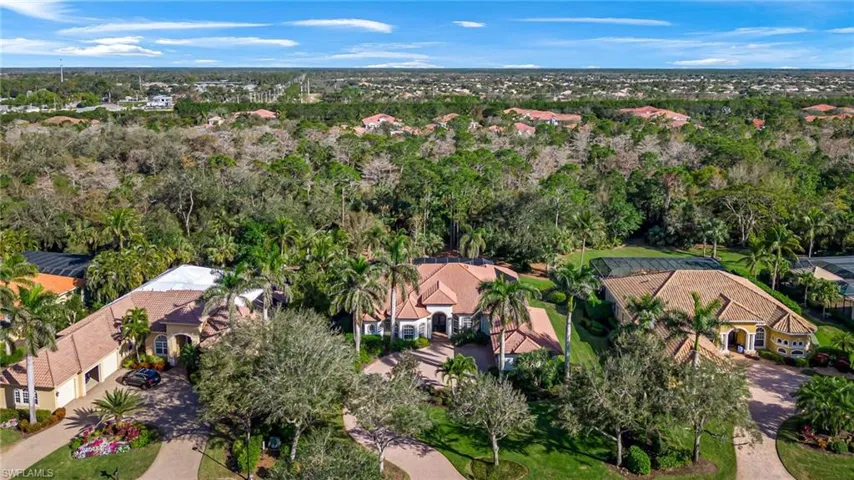 Aerial view of property's location featuring nearby suburban area