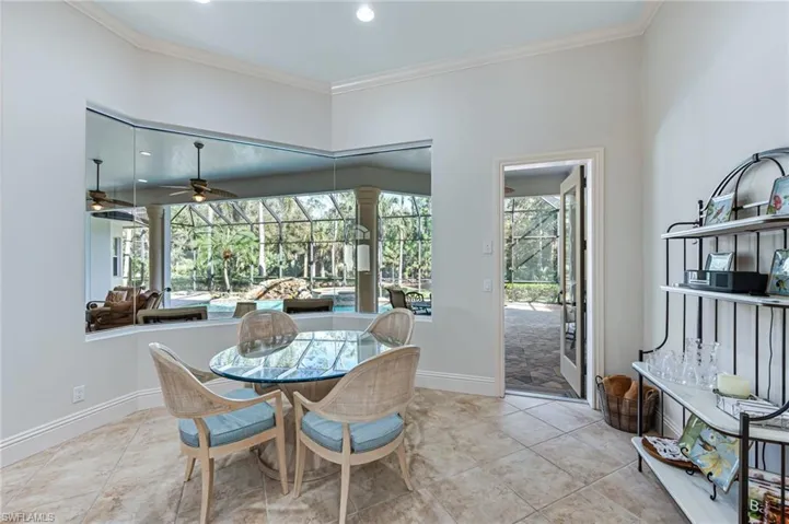 Dining area featuring crown molding, a ceiling fan, and recessed lighting