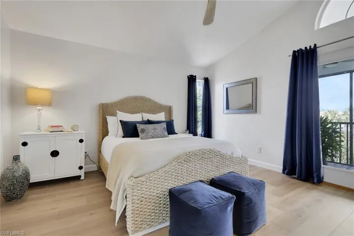 Upstairs landing, light ceramic tile flooring, and French doors as you enter the primary bedroom.