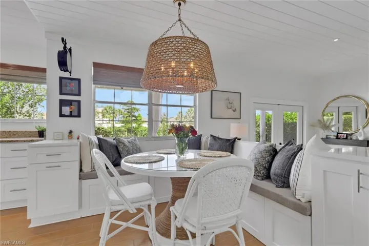 Family room with ornamental molding, ceramic wood floors, new ceiling & pocket lighting.