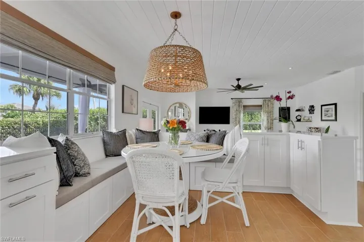Bedroom/office with light colored carpet, a ceiling fan, and ornamental molding