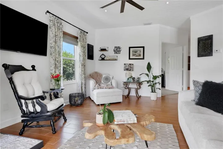 Kitchen featuring decorative light fixtures, granite countertops, white cabinets with upper cabinets that feature accent lighting, new stainless steel appliances.  Open and airy with lots of natural light overlooking the outdoor sanctuary.