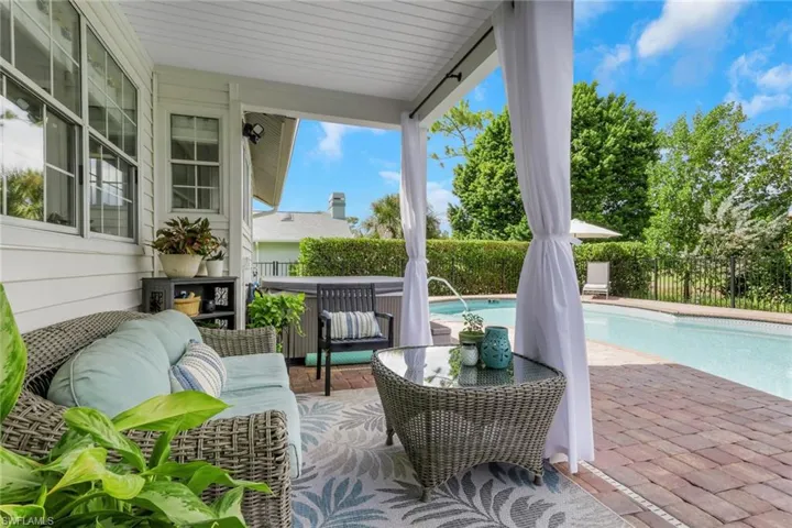 Just outside your kitchen & family room lies your private oasis.  Beautifully paved sidewalk surrounds the kidney shaped pool with hedges for privacy.