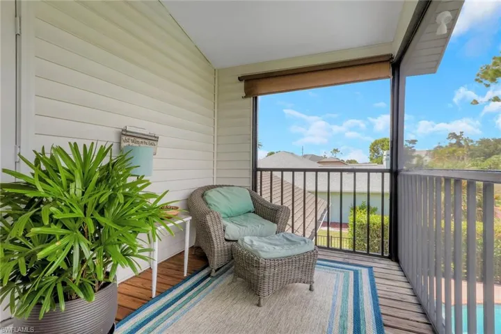 Primary bedroom has it's own private outdoor sanctuary, ceramic wood flooring, lofted ceiling, French doors, and a new ceiling fan