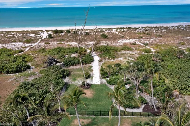 Bird's eye view with a beach view and a water view