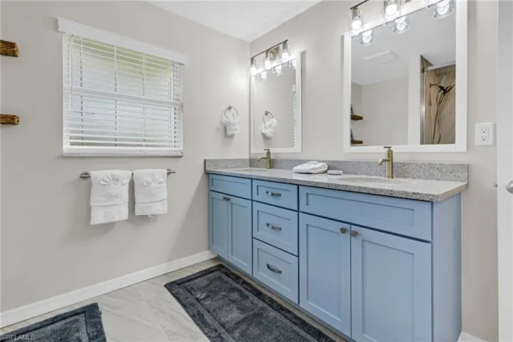 Bathroom featuring vanity and walk in shower