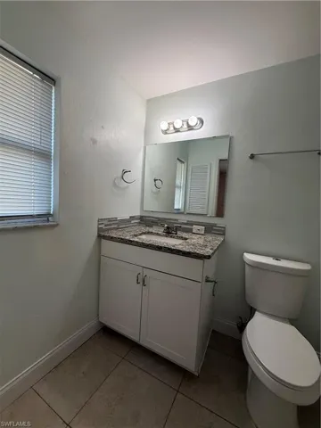 Bathroom with vanity and light tile patterned floors