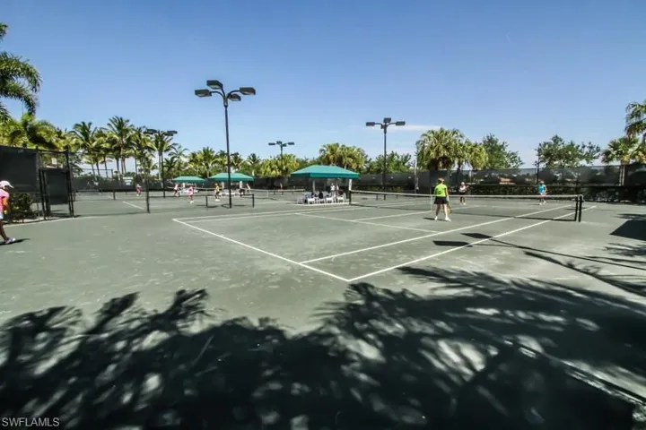 View of tennis court with fence