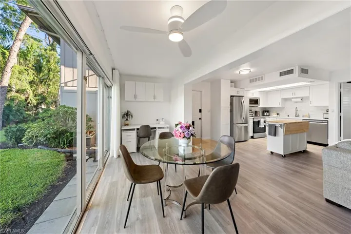 Dining space featuring light wood finished floors and ceiling fan
