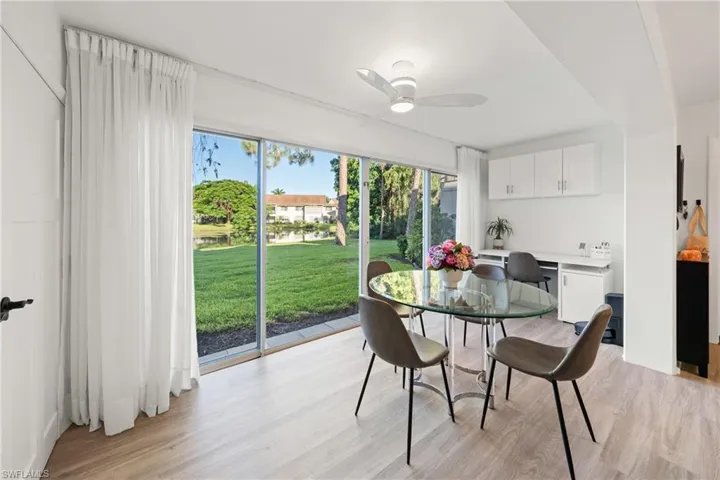 Dining room with light wood-type flooring and ceiling fan