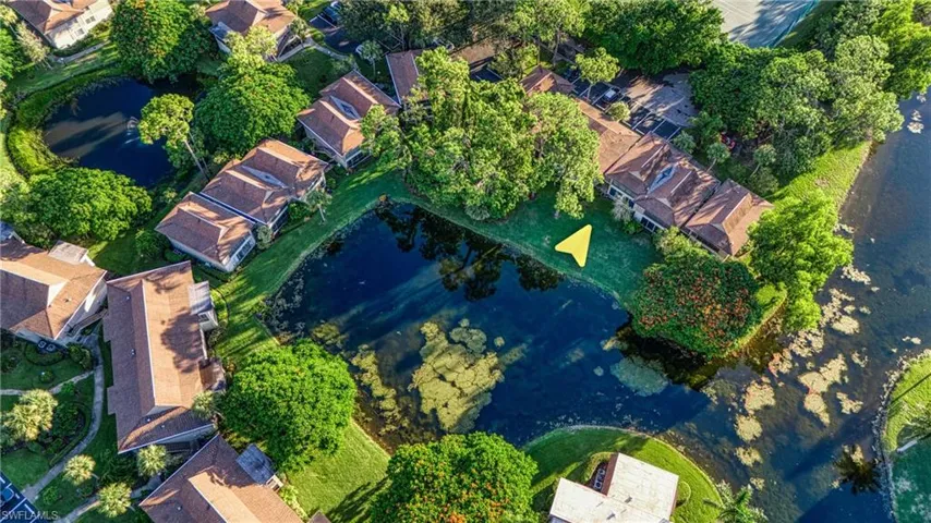 View of property location with a nearby body of water and nearby suburban area