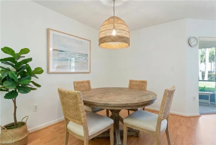 Dining area with light wood-type flooring