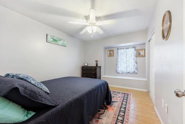 Bedroom with wood finished floors and a ceiling fan