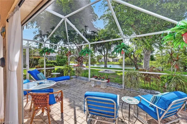 Relax in the massive screened lanai in your backyard