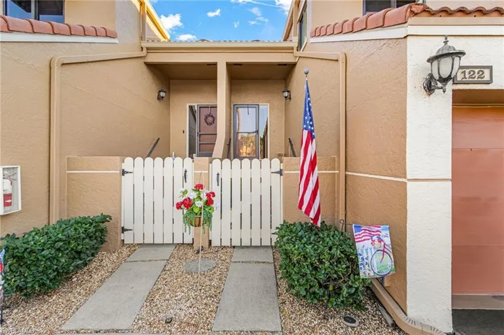 The subject property has the flag in the front