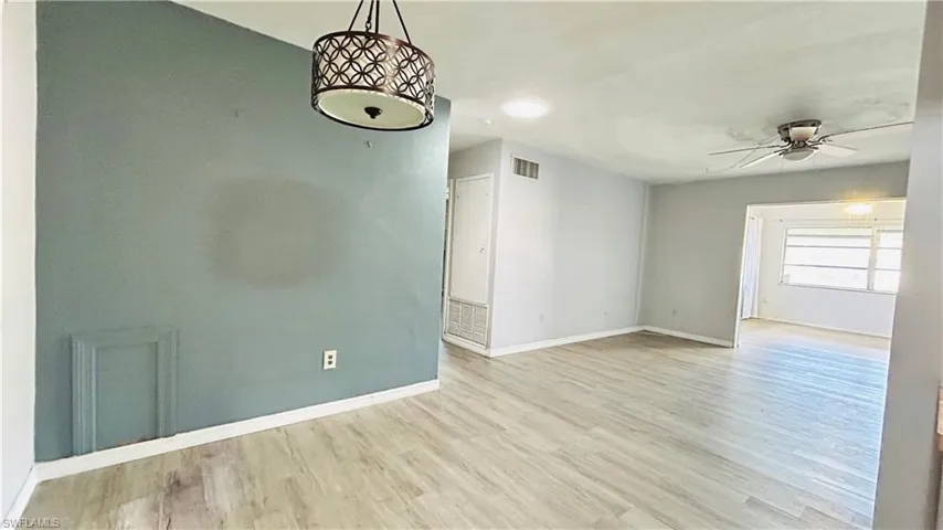 Unfurnished room with light hardwood / wood-style flooring and ceiling fan