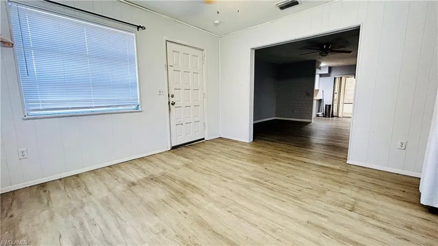 Entryway with ceiling fan and light hardwood / wood-style flooring