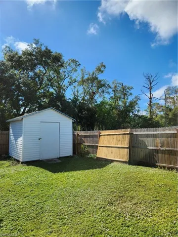 View of yard featuring a storage shed
