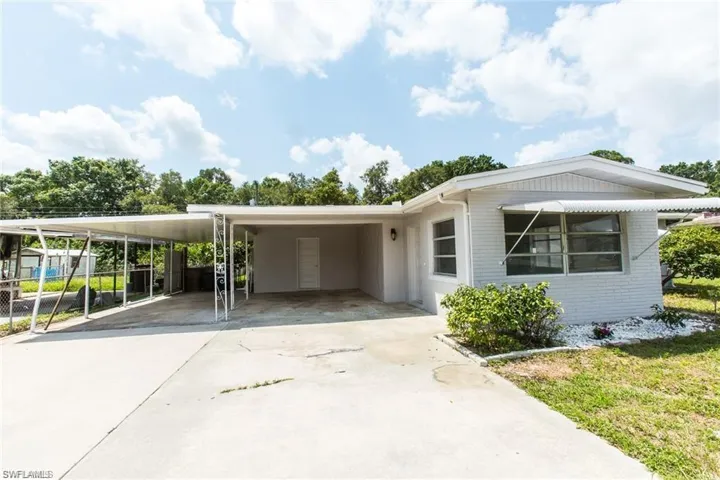 View of front of property featuring a carport