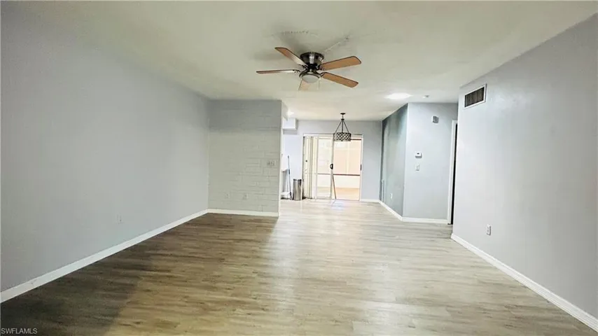 Family room with ceiling fan and hardwood / wood-style flooring
