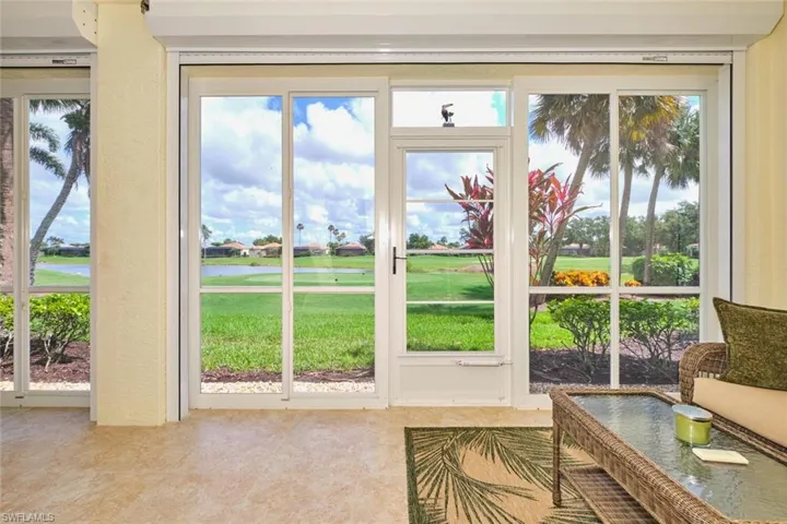 Entryway featuring plenty of natural light and tile patterned flooring